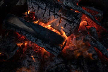 close-up of burning firewood wisth small flame