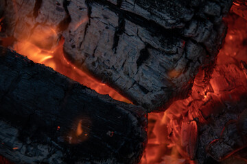close-up of burning firewood wisth small flame