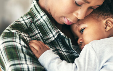 Motherly tenderness. Shot of a mother cradling her little baby boy.