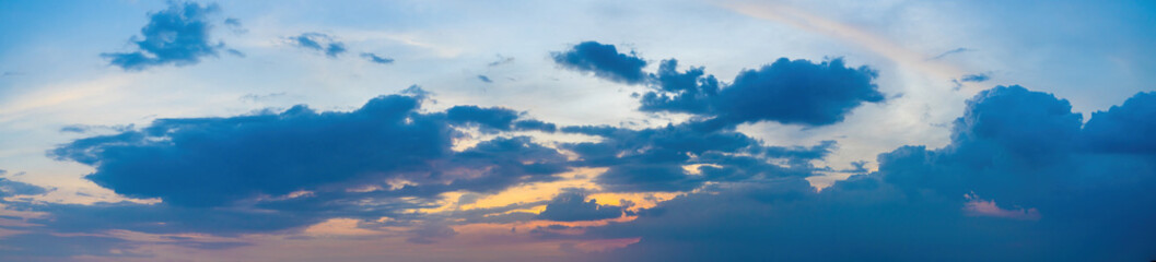 Fototapeta premium Beautiful view of sky with clouds at sunrise. Partly cloudy. Colorful sunset. Natural sky background texture, beautiful color.
