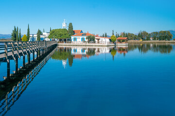 Nicholas, built on lake vistonida, port of lagos, xanthi region in northern greece. Magnificent landscape of a european country. View from the bridge to the beautiful monastery of st. Architecture