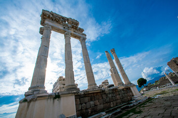 Turkey, izmir. Ancient ruins against a bright blue sky. Tall antique columns. Destroyed buildings