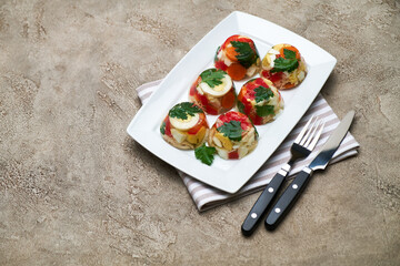 Portion of delicious chicken aspic on a plate isolated on concrete table
