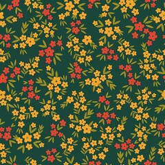 Seamless vintage pattern. Small yellow and red flowers, green leaves. Dark green background. vector texture. fashionable print for textiles, wallpaper and packaging.