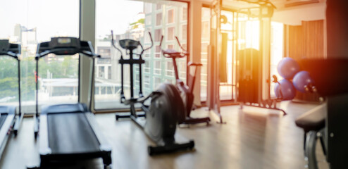 Abstract blur background. interior of modern fitness center gym - obrazy, fototapety, plakaty