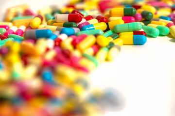 Fototapeta na wymiar colorful pills on white background 
