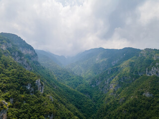 Fototapeta na wymiar Aerial drone panoramic view of deep gorge and rocky ridge leading to legendary Mountain Olympus