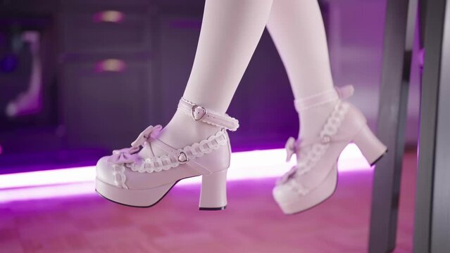 Dangling legs pink lolita high heels of the table in kitchen close-up 4K