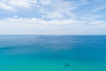Aerial view of blue sea surface water texture background Drone flying over sea Waves water surface texture on sunny tropical ocean in Phuket island Thailand