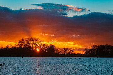 Beautiful sunset with reflections at Plattling, Isar, Bavaria, Germany