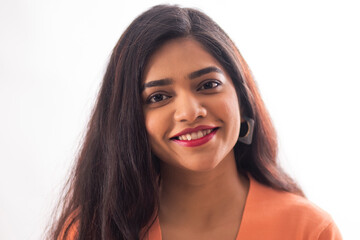 Close-up portrait of a young woman looking at camera