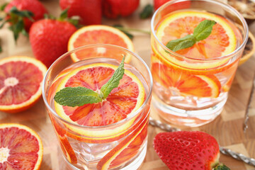 Cooling drinks cocktails in glasses, grapefruit with mint, cheers or toast