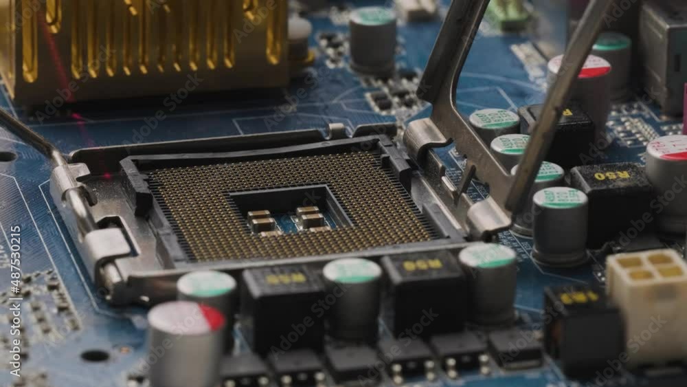 Poster cpu processor socket being scanned by red laser, motherboard with electronic components, close up