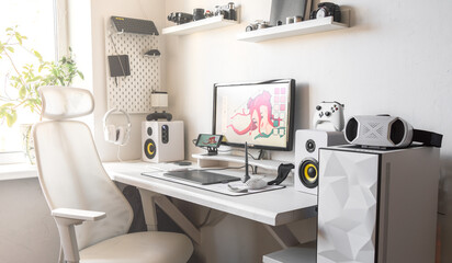  Convenient digital artist workspace with graphic tablet and sketching.