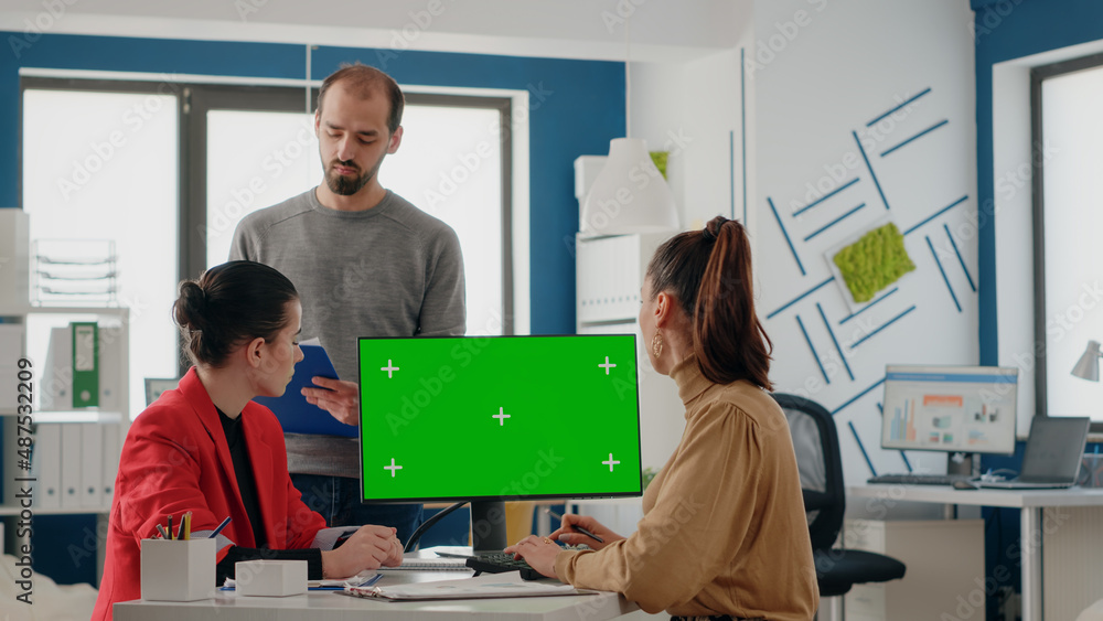 Poster business people working on computer with green screen in startup office. colleagues doing teamwork a