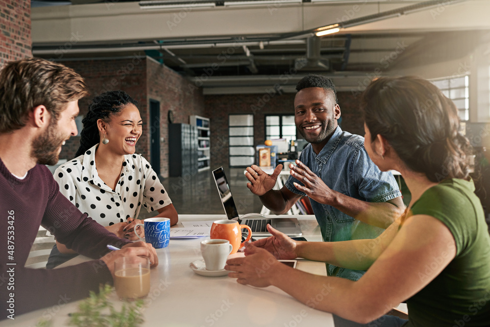 Poster Brainstorming makes for a great team building exercise. Shot of a team of colleagues having a meeting in a modern office.
