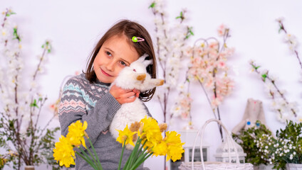 Portrait of young beautiful girl with pets rabbit. Easter concept. Copy space.