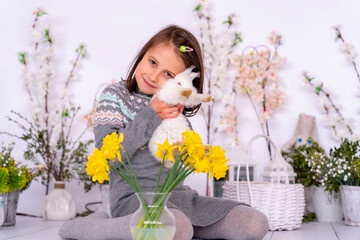 Obraz na płótnie Canvas Portrait of young beautiful girl with pets rabbit. Easter concept.