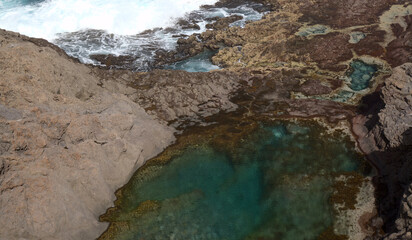 North of Gran Canaria, rockpools and natural swimming pools around Faro de Sardina lighthouse, 
the group called Espejos del Norte, i.e. Mirrors of the North