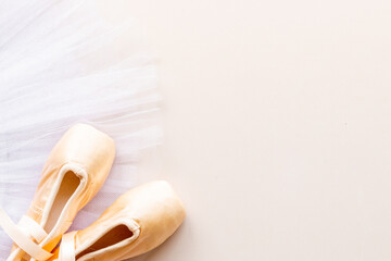 Used ballet pointe shoes on tutu skirt. Set for ballerina