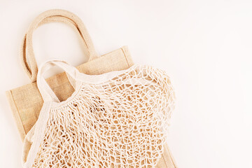 Eco Bags.A variety of eco bags on a yellow background . Sustainable lifestyle.Zero waste minimal composition with tring and canvas bags for storage.Zero waste, eco friendly shopping.Top view,flat lay.