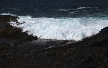 Gran Canaria, north coast, rockpools around Puertillo de Banaderos area protected from the 
ocean waves by volcanic rock barrier