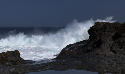 Gran Canaria, north coast, rockpools around Puertillo de Banaderos area protected from the 
ocean waves by volcanic rock barrier