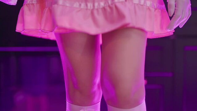 Pink maid dress short skirt and knees while walking in slow mov tracking 4K
