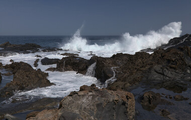 Gran Canaria, north coast, rockpools around Puertillo de Banaderos area protected from the 
ocean waves by volcanic rock barrier