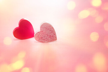 Fototapeta premium valentine's day, two hearts on a pink background.Two Hearts On Pink In Shiny Background - Valentine's Day Concept.