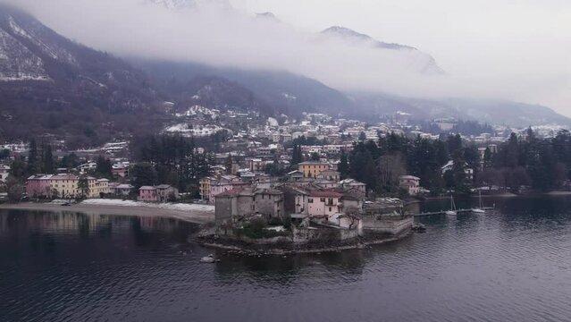 Aerial parallax view of Lierna village on Lake Como after the snow.