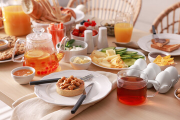 Dishes with different food on table indoors. Luxury brunch