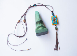 Flat lay with big nouse and ethnic pendant.