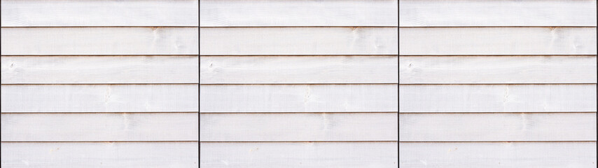 Texture background banner panorama of an exterior facade of a house with white wooden planks panels