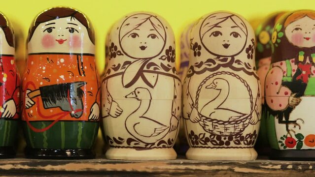 Black-and-white nesting dolls among other multicolored.