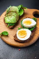 open sandwich egg, avocado, whole wheat bread breakfast sandwich healthy food fresh healthy meal food diet snack on the table copy space food background