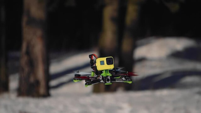 The drone flies around and takes pictures on a fixed camera. Shooting in close-up