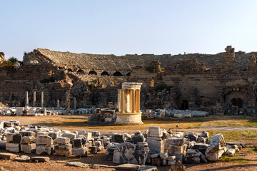 Temple of Fortune (Tyche Tapinagi) at commercial Agora, ancient theather in the background. Side...