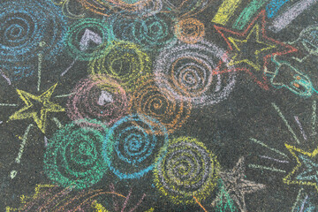 colored chalk rainbow circles drawing on the asphalt. High-quality photo