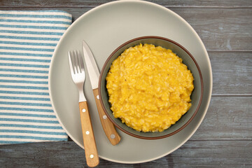 butternut risotto in a bowl on a table