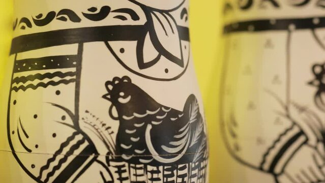A close-up image of the clothes of black-and-white nesting dolls.
