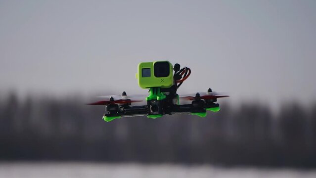 A wonderful close-up of a drone flying in the air. A very cinematic plan