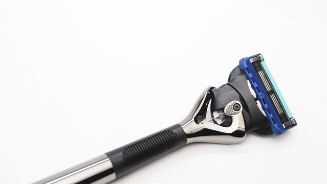 Modern men's razor with a lot of blades on a white background. Gift for the modern man. Body and beard care. Blitz machine.