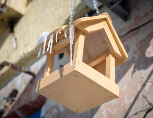 Feeder, bird house in winter. snow covered bird feeder