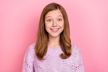Fototapeta premium Portrait of attractive cheerful glad red-haired teen girl wearing knitwear good mood isolated on pink pastel color background