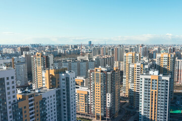 Obraz premium City view from a height, many high-rise buildings to the horizon.