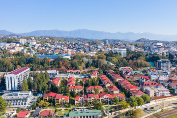 Fototapeta premium Coastal resort town by the sea and mountains in the distance.