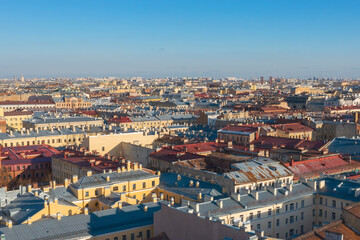 Fototapeta na wymiar Cityscape aerial view of the rooftops in the central area of the city of St. Petersburg, deck houses, residential buildings.