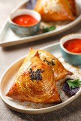 Samosa, samsa meat stuffed pies. Uzbek national dish samosa. Concept of Central Asian, South and East Asian cuisine