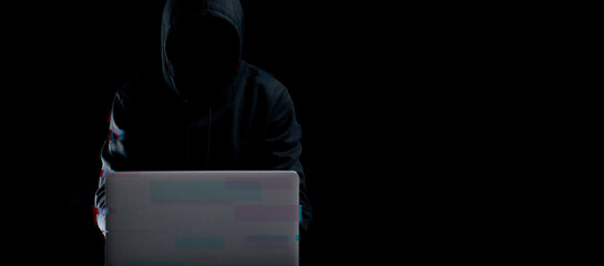 Cyber attack hacker concept. Internet web hack technology. Blurred Digital laptop in hacker man...